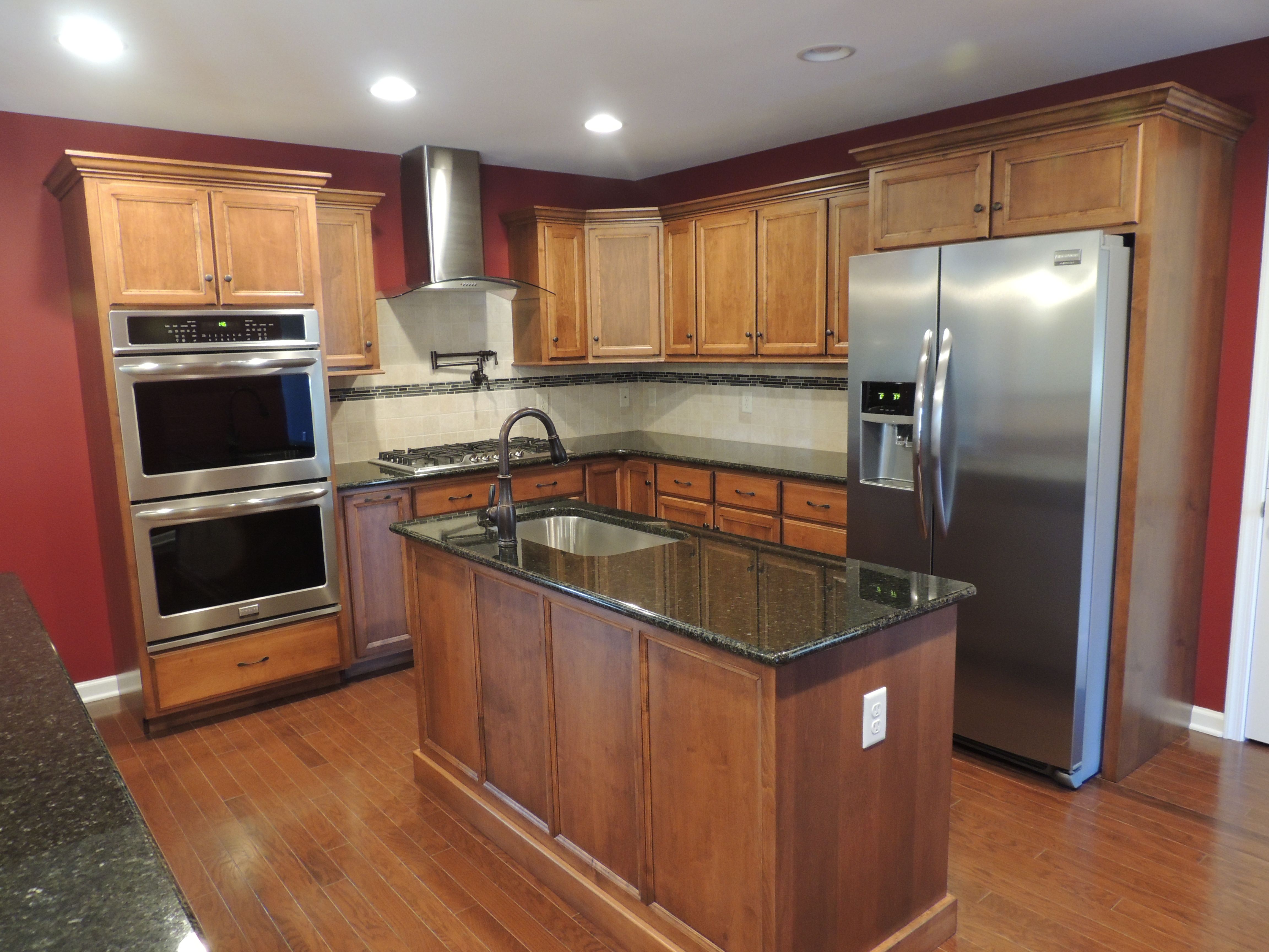 Stainless steel appliances are so sharp looking with this kitchen! #